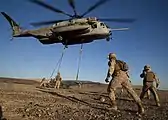 Marines supporting Weapons and Tactics Instructors (WTI) Course 1-14, participate in a CH-53E Super Stallion sling loading exercise at Landing Zone Bull on the Chocolate Mountain Aerial Gunnery Range (2013)
