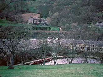 The section of canal Rimer's body was found in, viewed from the top of the nearby hill in 1996. Behind the trees to the left of the image is the factory site which Rimer's was found next to and where she was possibly taken to and murdered. It is now demolished and used as an industrial storage site.