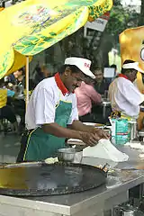 Another picture of roti canai preparation.