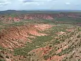 Side canyon carved by erosion.