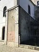 Section of cerca fernandina embedded in wall of Graça convent, at the site of Porta da Graça (Graça Gate), looking into enclosure.