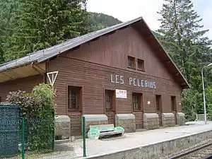 Wooden two-story building with gabled roof