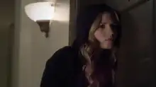 Actress Vanessa Ray as CeCe Drake eavesdropping on a conversation, using a black hoodie, blonde hair.