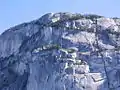 The Chief's Grand Wall area, a vertical sea of some of the world's finest granite. To the right the Black Dyke can be seen bisecting the rock face.