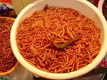 A dish of chinicuiles (roasted larvae of Hypopta agavis) in a market in Tula, Hidalgo, México