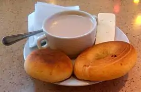 A traditional breakfast of Bogotá: hot chocolate with cheese, almojábanas and pan de queso