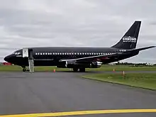 a Boeing 737-200 in matte black Chrono library