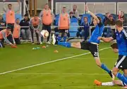 Stretching for a free kick in 2015