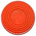A 10 centimetres (4&nbsp;in) clay pigeon.