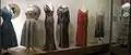 Display of 1920s–1950s costume (with one 1880s costume on the right).