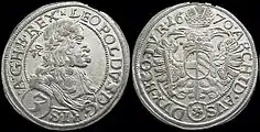 Silver coin of Leopold I, 3 Kreuzer, dated 1670. The Latin inscription reads (obverse): LEOPOLDVS D[EI] G[RATIA] R[OMANORVM] I[MPERATOR] S[EMPER] A[VGVSTVS] G[ERMANIAE] H[VNGARIAE] B[OHEMIAE] REX (reverse):ARCHID[VX] AVS[TRIAE] DVX B[VRGVNDIAE] CO[MES] TYR[OLIS] 1670. In English: "Leopold, by the Grace of God, Emperor of the Romans, always August, King of Germany, Hungary, and Bohemia, Archduke of Austria, Duke of Burgundy, Count of Tyrol, 1670."