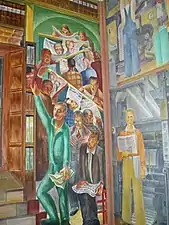 Headlines in the newspapers discuss current events, including the creating of the murals.(Bernard Zakheim, Library .mw-parser-output .legend{page-break-inside:avoid;break-inside:avoid-column}.mw-parser-output .legend-color{display:inline-block;min-width:1.25em;height:1.25em;line-height:1.25;margin:1px 0;text-align:center;border:1px solid black;background-color:transparent;color:black}.mw-parser-output .legend-text{}&nbsp;7&nbsp;)