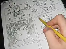 A hand pencils details on a page already largely filled with frames of a comic