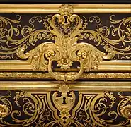Louis XIV marquetry and gilded bronzes with delicate rinceaux, typical of André-Charles Boulle's works