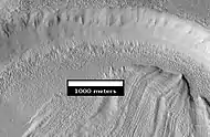 Concentric Crater Fill Close-up of near the top of previous image.  The surface debris covers water ice.