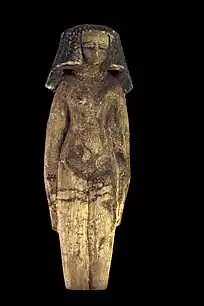 Ushabti of a Concubine; nude except for jewellery and a heavy wig. Painted wood, Middle Kingdom of Egypt