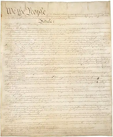 Image of handwritten copy of the Constitution.