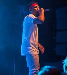 Cozz performing during Too High to Riot Tour in 2016.