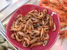 A bowl of grey shrimp as a snack.