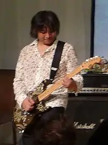 Senoue performing in 2010