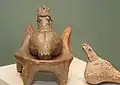 A clay Precucuteni Goddess and chair