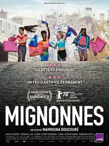 Four jovial pre-teen girls at the streets carrying paper bags, with confetti around them.