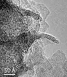 High-magnification transmission electron microscope (TEM) image of δ-.mw-parser-output .template-chem2-su{display:inline-block;font-size:80%;line-height:1;vertical-align:-0.35em}.mw-parser-output .template-chem2-su>span{display:block;text-align:left}.mw-parser-output sub.template-chem2-sub{font-size:80%;vertical-align:-0.35em}.mw-parser-output sup.template-chem2-sup{font-size:80%;vertical-align:0.65em}MnO2 nano-crystals viewed parallel and perpendicular to the layer plane.