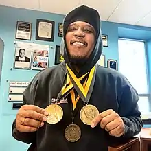 Watkins in Baltimore office displaying awards, December 2022