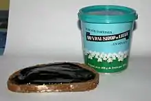 Sirop de Liège on a slice of bread.