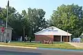 American Legion post with M101 howitzer on display, W. River St.