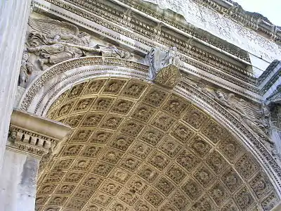The elaborate carvings and coffered vault of the Arch of Septimius Severus