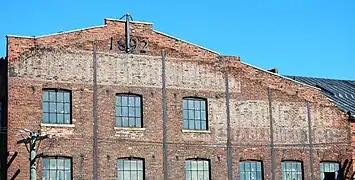 South side wall, 2009.  Note construction date and remnants of "Detroit Shipbuilding Machine Shop" sign