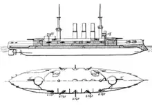 Top and side views of a large ship with a pointed bow, two large gun turrets on the center line, a battery of smaller guns arrayed around the center of the ship, two tall masts, and three thin smoke stacks.