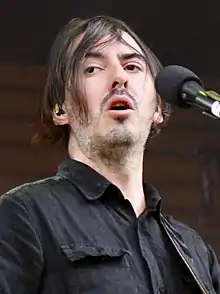 Harrison performing in July 2018