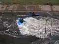 Features of the Channel.  Side-surfing in the Middle Hole at full flow 600&nbsp;cu&nbsp;ft/s (17&nbsp;m3/s).