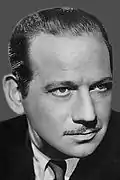 Black-and-white studio publicity portrait of Melvyn Douglas circa 1939.