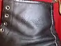 Dr. Martens logo stamped on the outer side of a boot.