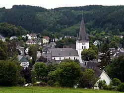 View of Drolshagen towards south from Papenberg (417&nbsp;m). St. Clement's Church dominates the skyline.