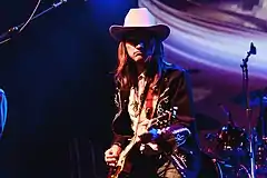 Duane Betts playing guitar onstage
