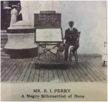 E. J. Perry, to the right of his booth, in 1905