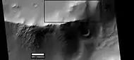 Layers in crater wall, as seen by HiRISE under HiWish program. Area in box is enlarged in the next image.