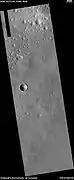 Wide view of expanded craters, as seen by HiRISE After the impact, ice left the ground and made the crater larger in diameter.