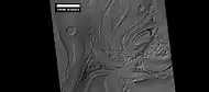 Close-up of banded terrain on the floor of the Hellas basin, as seen by HiRISE  Other, previous photos show wide views of this region.
