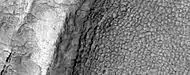 High-center polygons, as seen by HiRISE under HiWish program  Image is of the top of a debris apron in Deuteronilus Mensae.