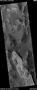 Light-toned mass in Aureum Chaos, as seen by HiRISE under HiWish program  Light-toned materials often form on Mars with the aid of water.