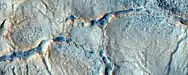 Close view of cracks and boulders, as seen by HiRISE under HiWish program