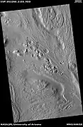 Row of mounds, as seen by HiRISE under HiWish program  Arrows point to some of the mounds.