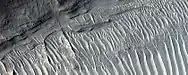 Close view of layers, as seen by HiRISE under HiWish program   A ridge cuts across the layers at a right angle.