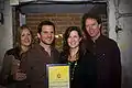 Nick and Helen Forster present the eChievement Award to environmentalist Lauren Sullivan (2nd from right) and her musician husband, Guster guitarist/vocalist Adam Gardner (2nd from left), of Reverb.
