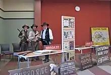 Frontier Village enthusiasts and collected memorabilia, primarily ride signs, displayed at the Edenvale Branch of the San Jose Public Library.